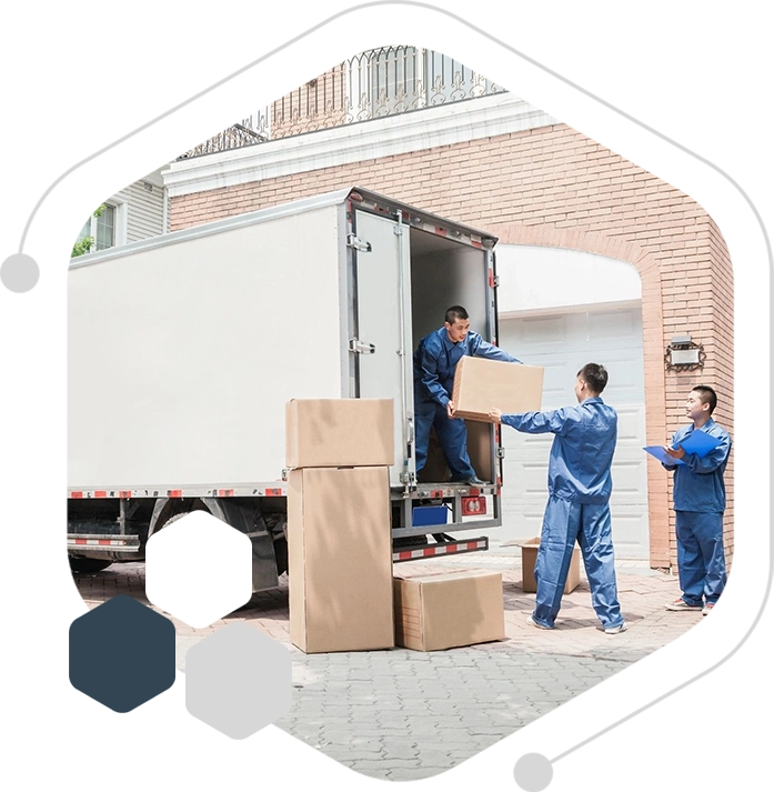 A group of people loading boxes onto a truck.