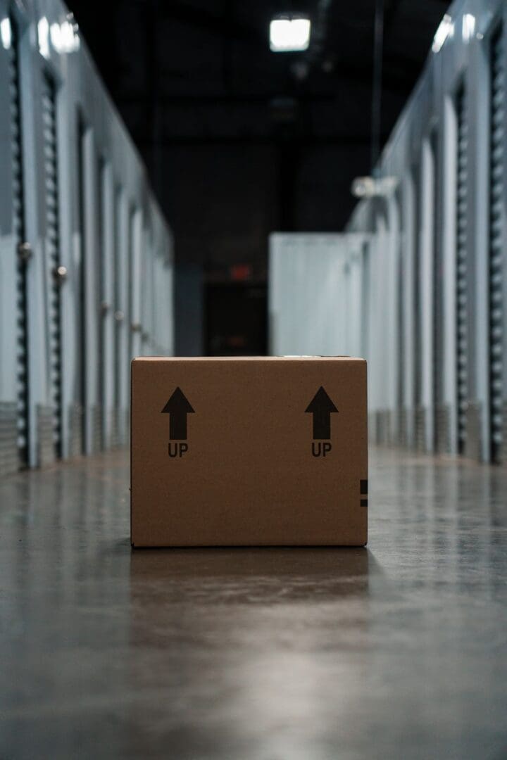 A box in the middle of a warehouse floor.