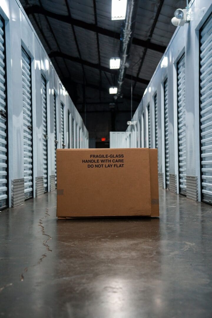 A box in the middle of an empty warehouse.