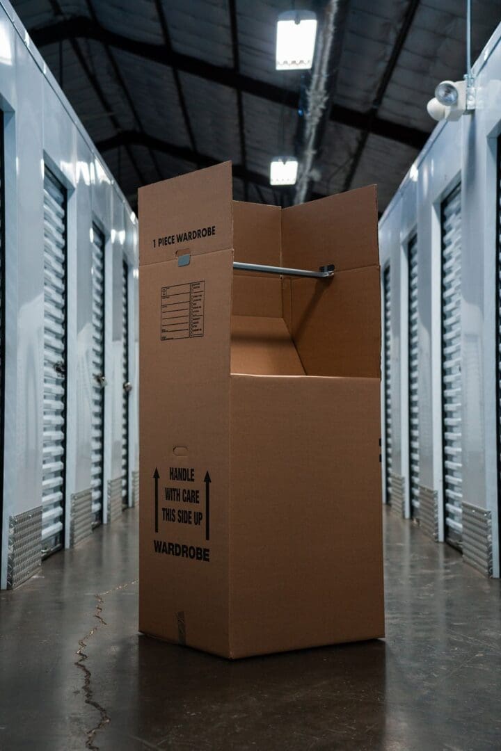 A cardboard box in the middle of a storage room.